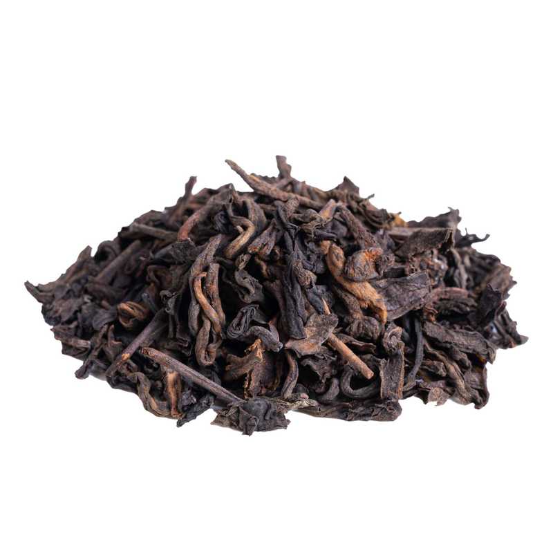 Pu Erh luomu. Sivukuvassa Pu Erh luomuteen tummia teelehtiä.