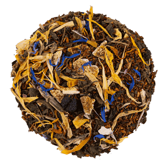 Aurinkoinen päiväuni luomu rooibos. Kuvassa Aurinkoinen päiväuni luomu rooibos, jossa nokkosta, appelsiininkuoria, aroniaa, kehäkukkia, ruusun terälehtiä, mangoa ja ruiskaunokkeja.